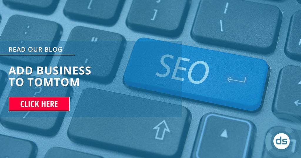 A close-up of a keyboard with a blue "seo" button highlighted and a call-to-action banner encouraging to read a blog about adding business to TomTom.